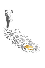 Pure gold wedding rings with hearts ornament and wedding couple