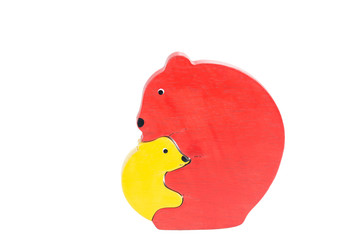 Bear and cub wooden puzzle over white background