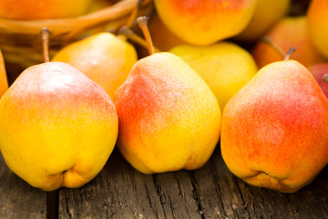 Yellow pears on wooden table