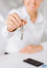 woman hand holding house keys