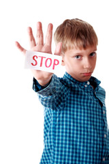 Beautiful boy shows a message "Stop" looking upset