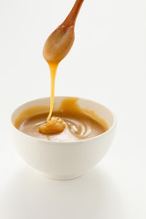 Pouring sweet caramel sauce