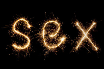 The word "Seh" in sparklers on black background