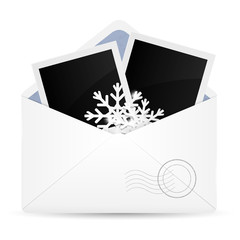 Open envelope with photo frame and snowflakes. 