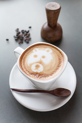 A cup of coffee with bear image