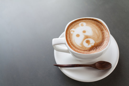 A cup of coffee with bear image