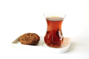Turkish tea in traditional glass with cookies