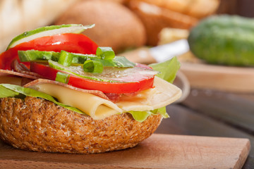 Healthy sandwich with cucumber, lettuce and tomato.