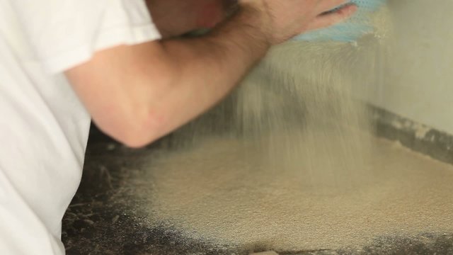 Flour being sieved