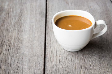 Hot coffee on wood