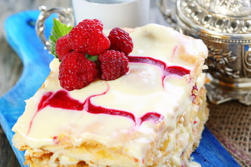 Puff pastry cake decorated with raspberries.