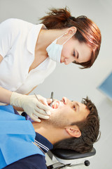 Fototapeta premium Dental assistant with male patient