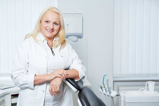 Senior denist in her dental practice