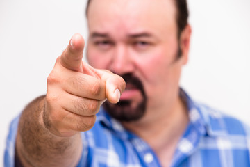 Man pointing an accusatory finger