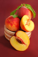 Fototapeta na wymiar three fresh peaches