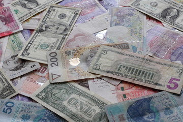 Fototapeta na wymiar Mix of pound sterling, US dollar and Polish zloty banknotes