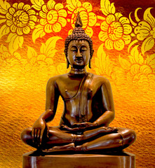 Buddha statue on a gold background.