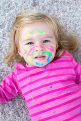 Obraz na płótnie Canvas Child with paint on face
