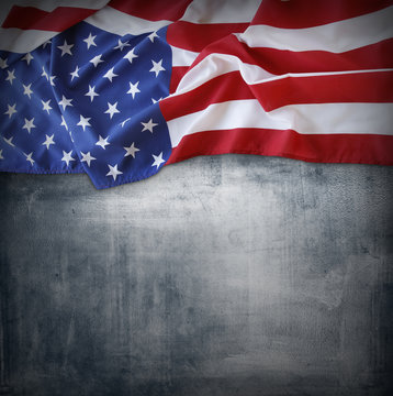 American flag on rough background 