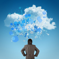 Businessman looking with Cloud Computing sign as splash colors a