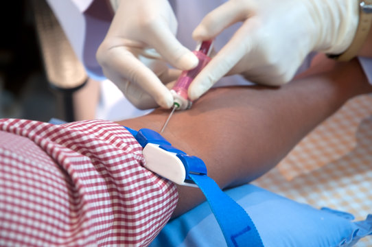 Doctor giving an injection to a patient