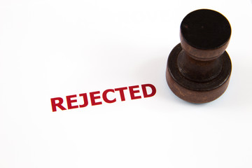 closeup of rejected letter on rubber stamp