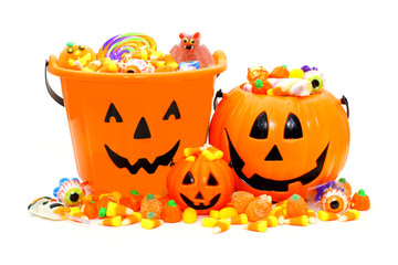 Group of Halloween Jack o Lantern candy holders and candies