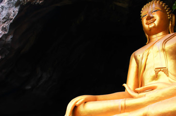 Beautiful golden Buddha statue located on a high mountain
