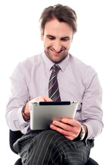 Young man working on tablet device