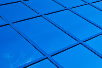 A fragment of blue glass building in the background