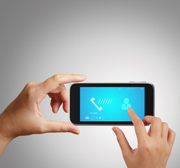 hand holding a touch phone with blue screen and the phone ringin