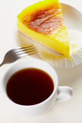 Tea and cake on white