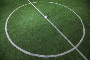 Obraz premium Soccer field with soccer ball on the line, high angle view
