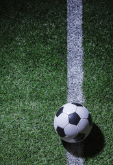 Fototapeta na wymiar Soccer field with soccer ball and line