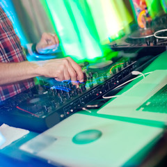 Dj mixing in night club