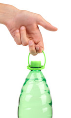 Hand holds plastic bottle.