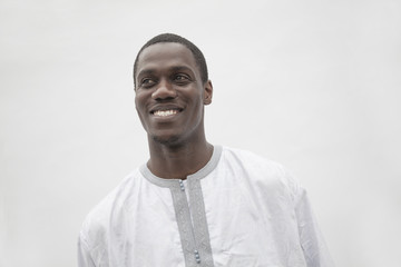 Obraz premium Portrait of young man in traditional African clothing, studio shot