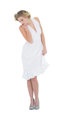 Cute fashion blonde model posing looking down