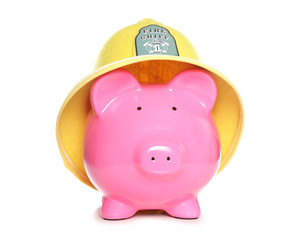piggy bank wearing firemans hat