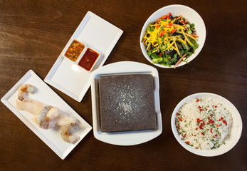 Components of cook it yourself fish dish with hot stone