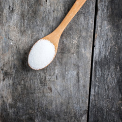sugar in a wooden spoon