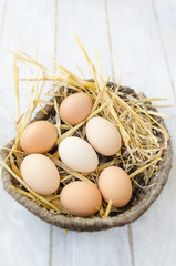 Brown eggs in a wicker basket