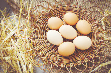 Brown eggs in a wicker plate