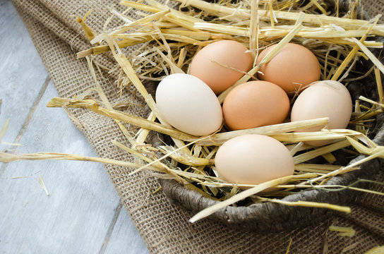 Brown hen eggs in a basket