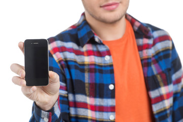 Men with mobile phone. Cropped image of cheerful young men holdi