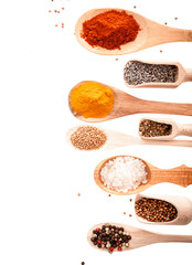Wooden scoops and spoons with assorted spices