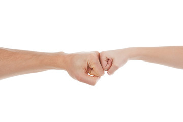 Hands together. Close-up of child and adult fists touching each