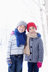 Fototapeta premium Boy and girl embracing, portrait