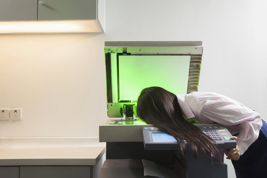 Businesswoman Photocopying Her Face
