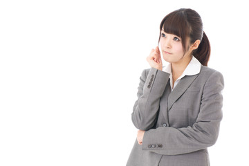 young businesswoman thinking on white background